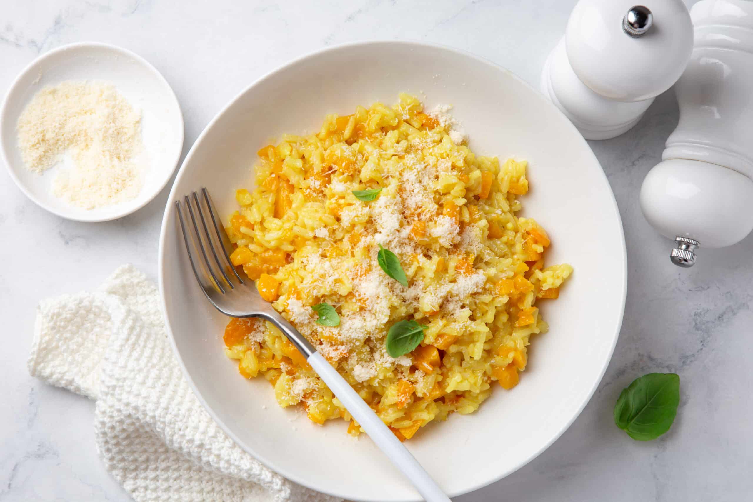 butternut squash risotto in a white bowl