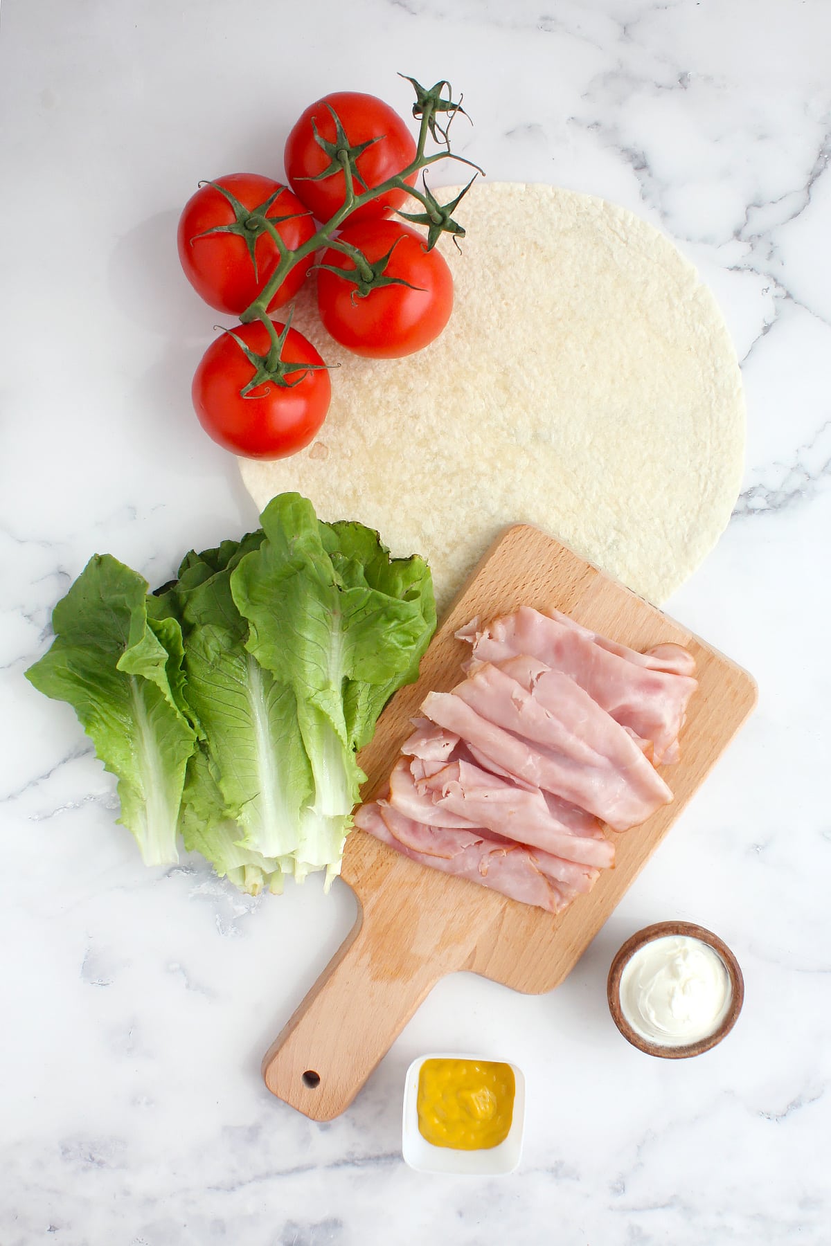 Ingredients you need to make ham and cheese pinwheels.