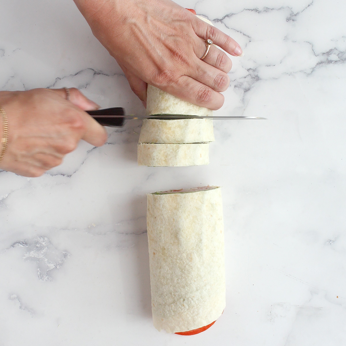 Process shots showing how to make ham and cheese pinwheels.