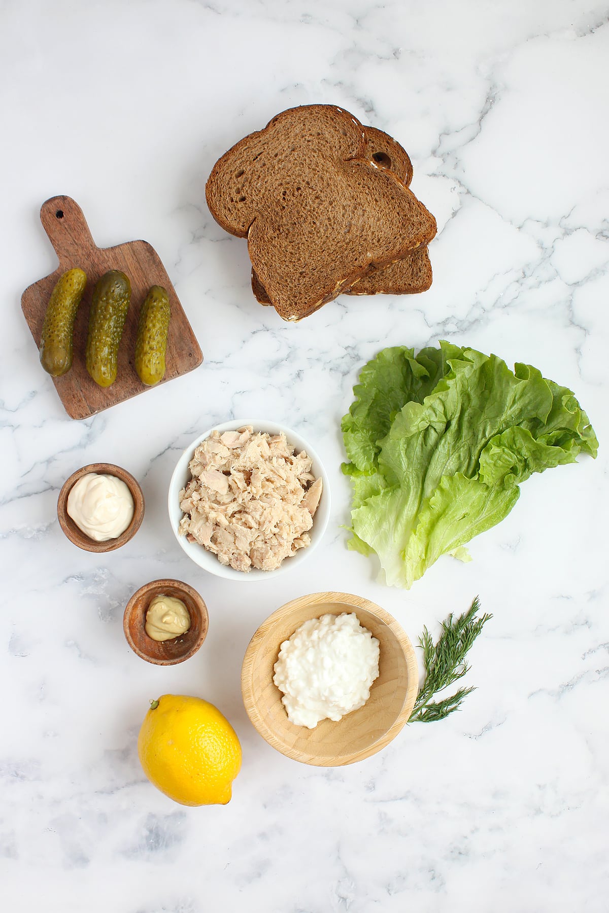 Ingredients needed to make this tuna salad sandwich.